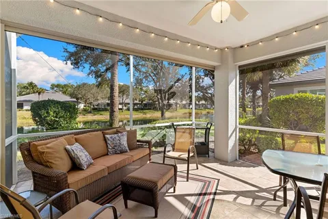an aerial view of residential houses with outdoor space and swimming pool