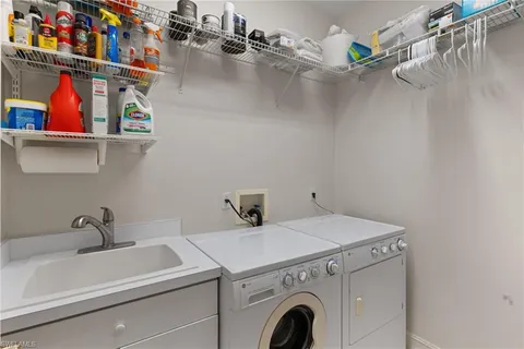 a room with pool table and windows