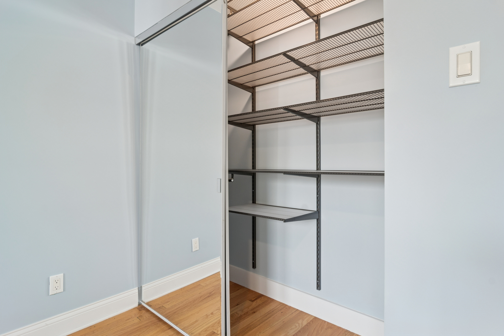 6232 North Broadway, Unit 2 Chicago, IL 60660 - Photo 18 of 23 a view of an empty room with wooden floor