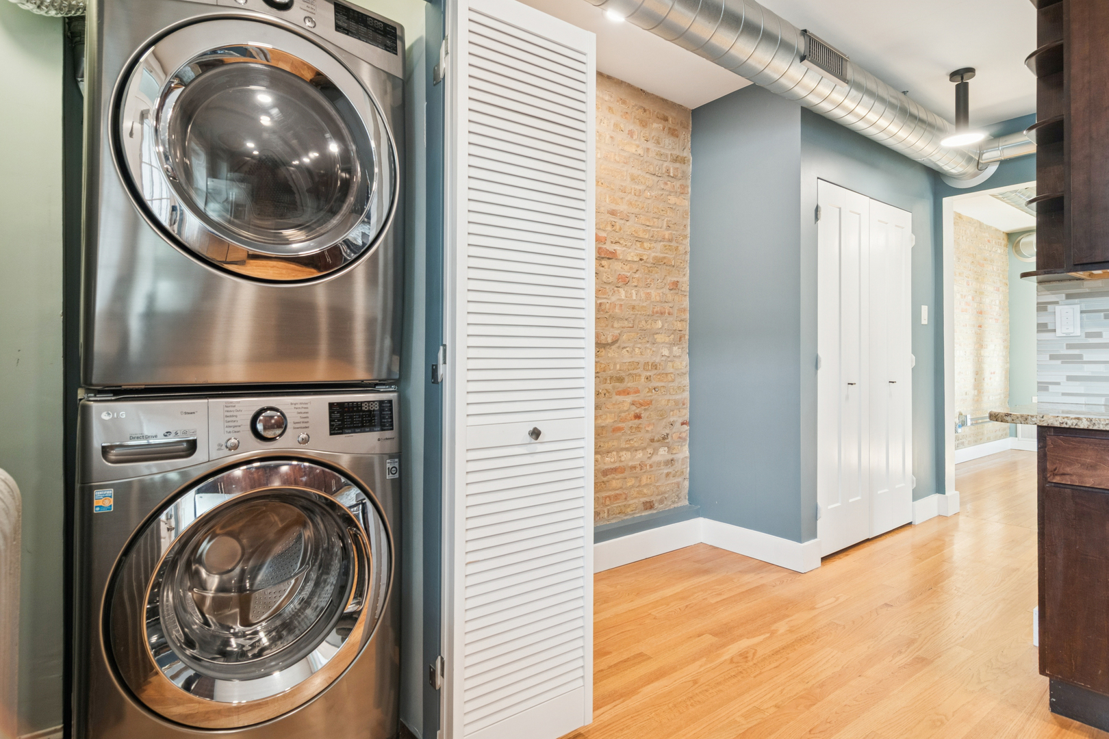 6232 North Broadway, Unit 2 Chicago, IL 60660 - Photo 5 of 23 a view of a hallway with washer and dryer