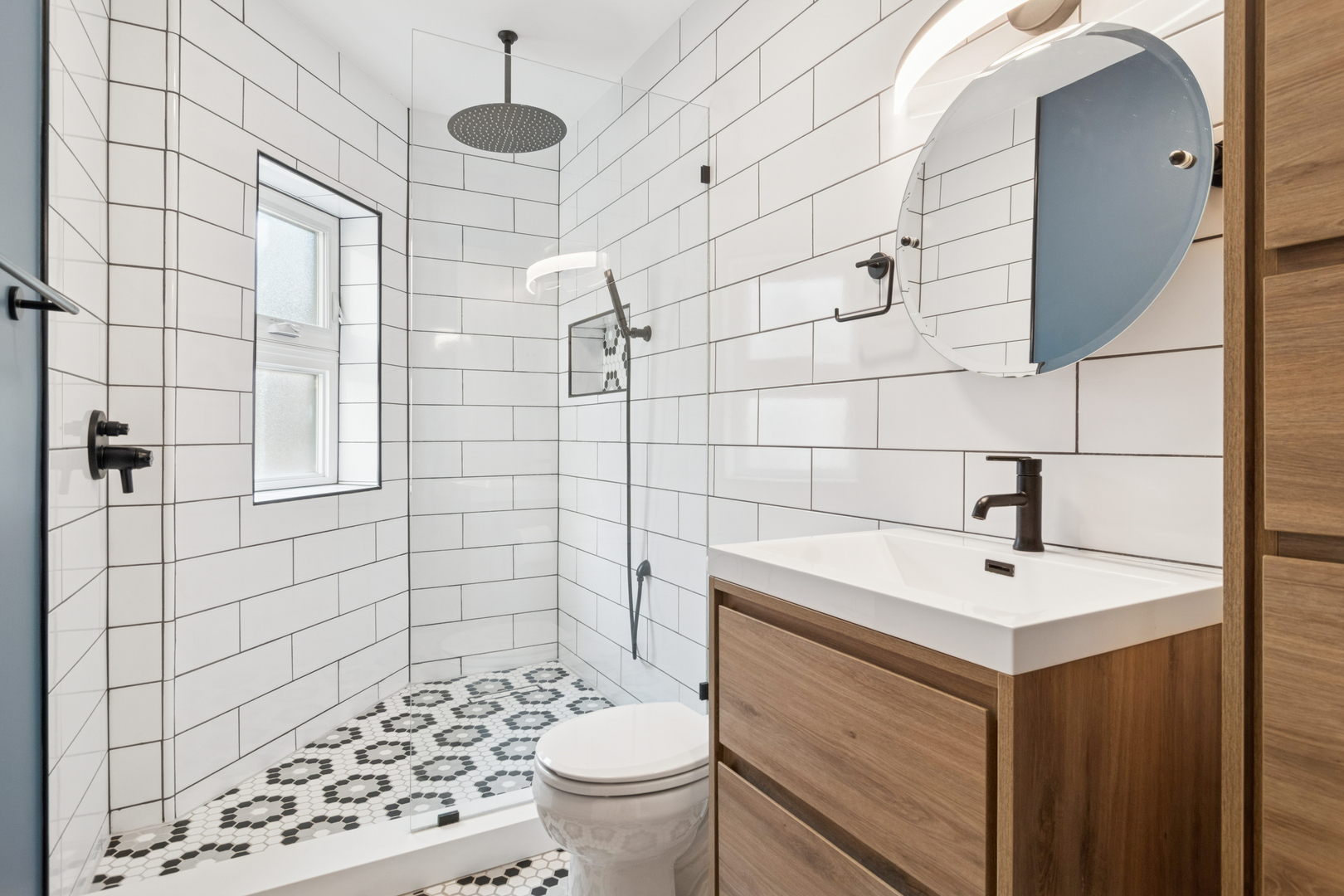 6232 North Broadway, Unit 2 Chicago, IL 60660 - Photo 8 of 23 a bathroom with a sink toilet and shower