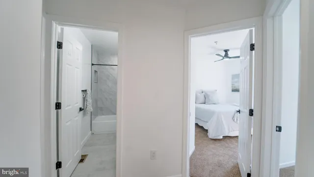a bathroom with a granite countertop shower