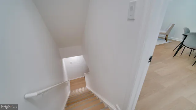 a view of a hallway with furniture