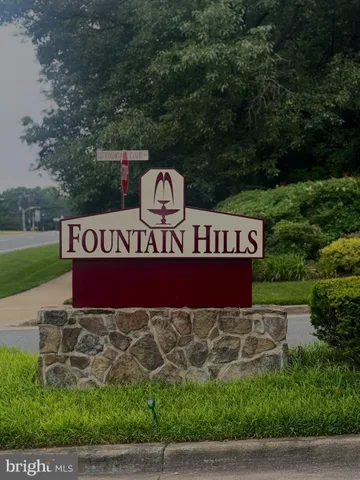 an aerial view of a house with a yard and trees
