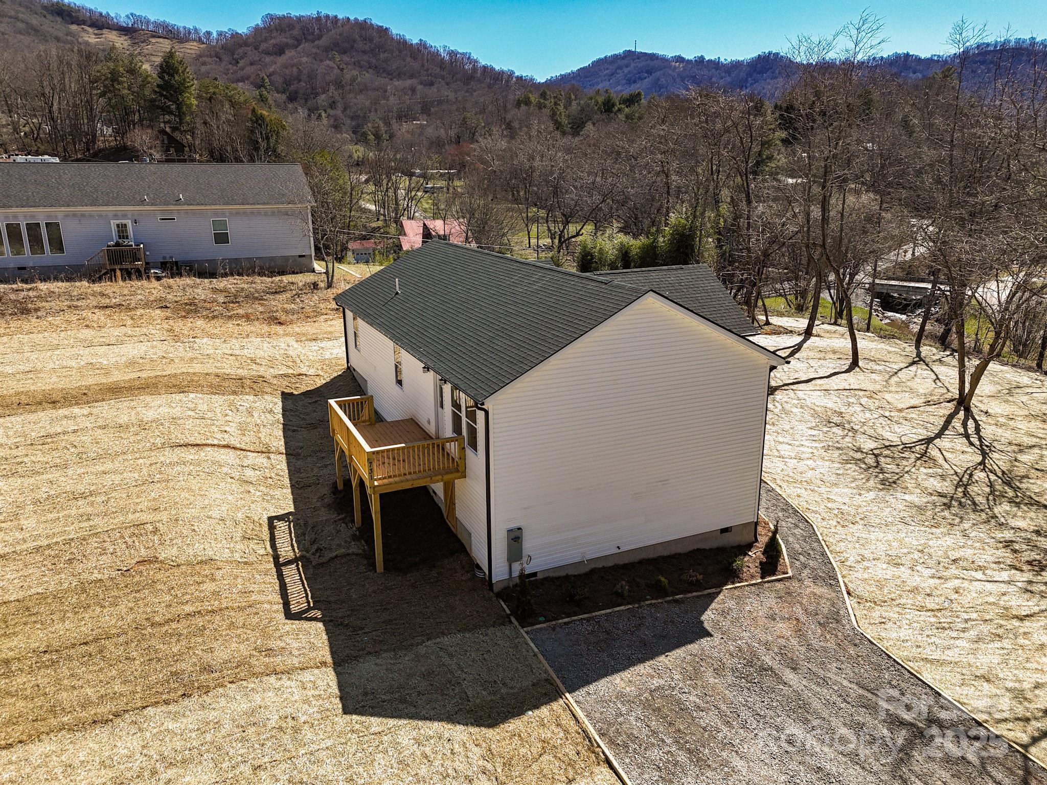 731 Abel Road Canton, NC 28716 - Photo 8 of 46 a view of a terrace with a bench