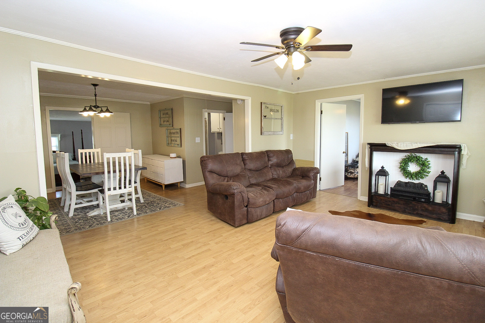 427 Pulaski High School Road Hawkinsville, GA 31036 - Photo 14 of 29 a living room with furniture a flat screen tv and a fireplace