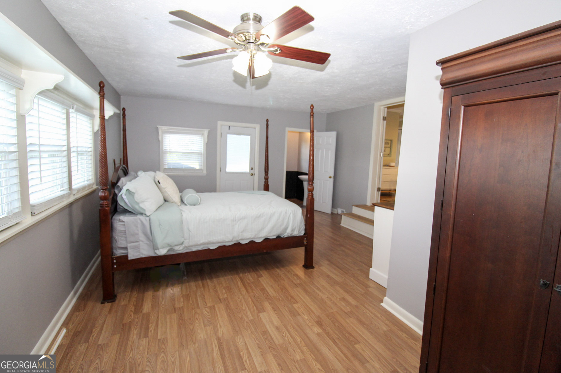 427 Pulaski High School Road Hawkinsville, GA 31036 - Photo 15 of 29 a bedroom with a bed and a window