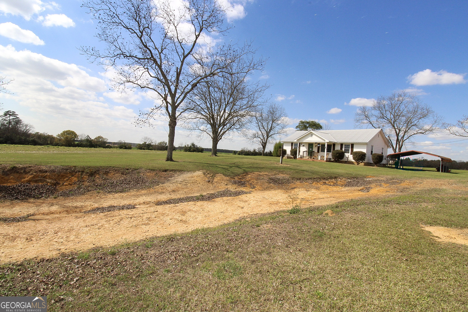 427 Pulaski High School Road Hawkinsville, GA 31036 - Photo 2 of 29 a view of a city street and trees