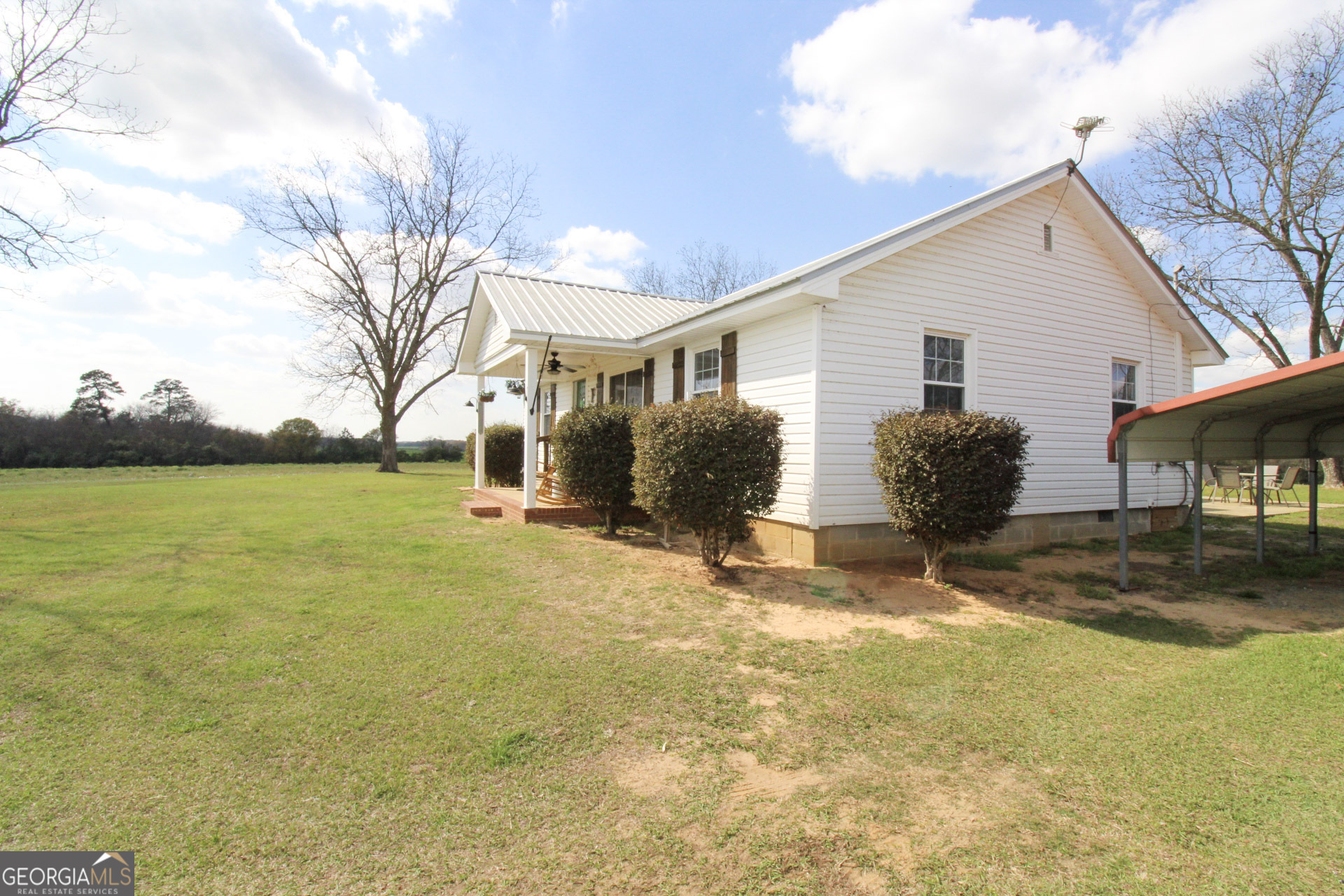 427 Pulaski High School Road Hawkinsville, GA 31036 - Photo 3 of 29 a view of a house with backyard and trees