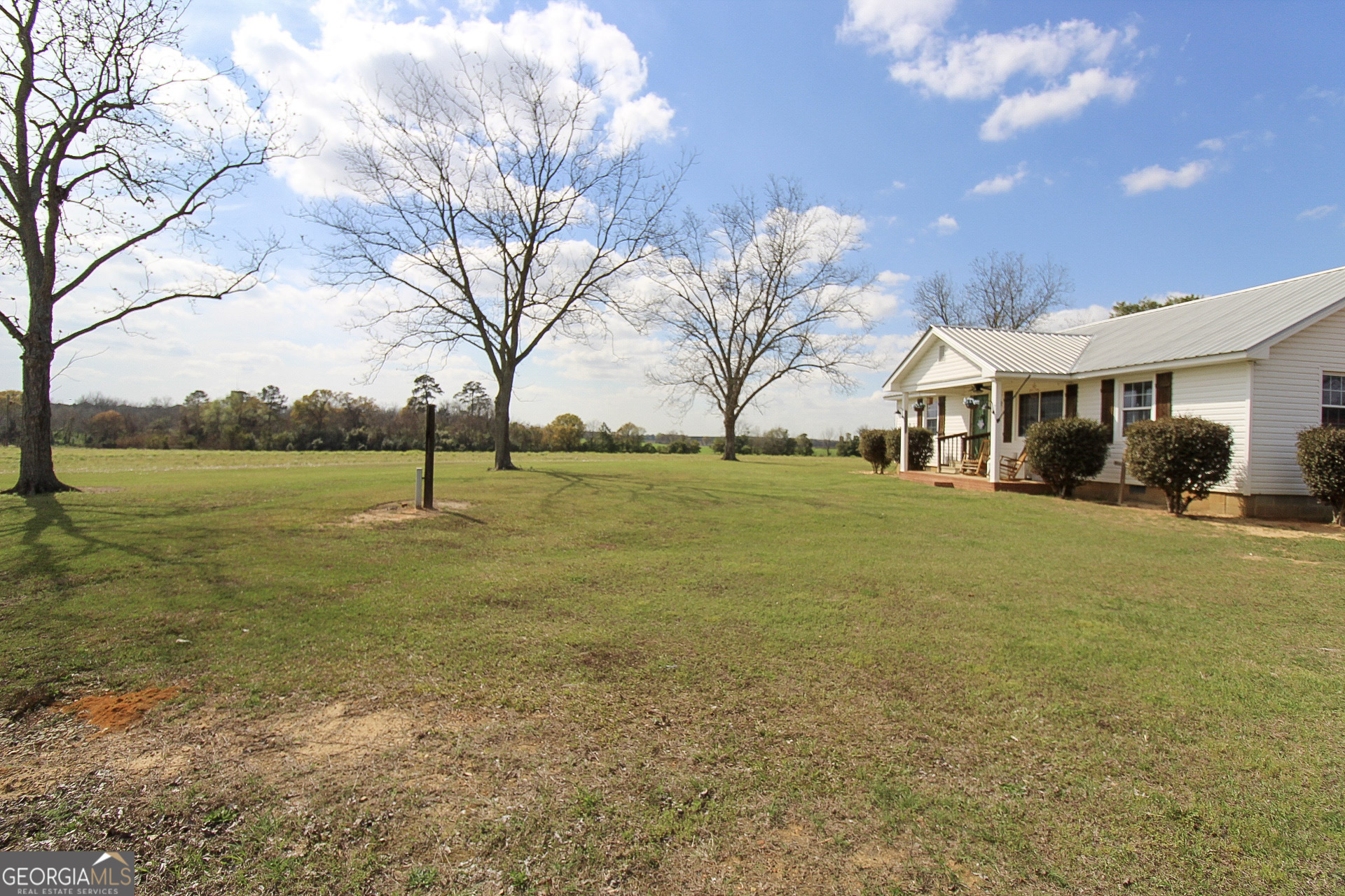 427 Pulaski High School Road Hawkinsville, GA 31036 - Photo 5 of 29 a view of a lake with a house in the background