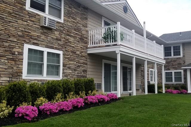 522 Terrace Road, Unit T14522 Bayport, NY 11705 - Photo 3 of 14 a front view of house and yard with green space