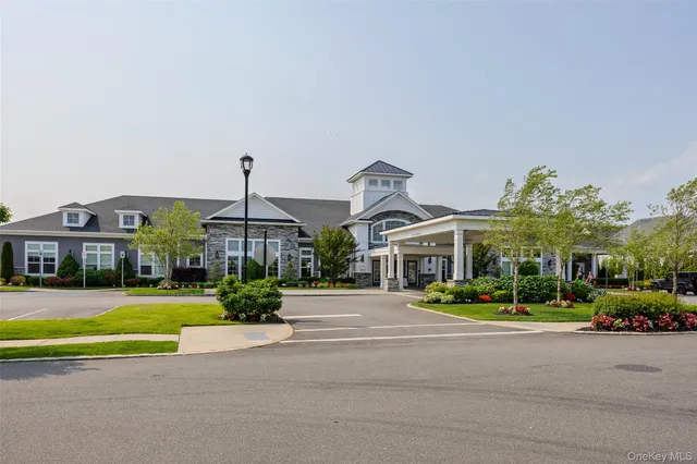 a front view of multiple houses with yard
