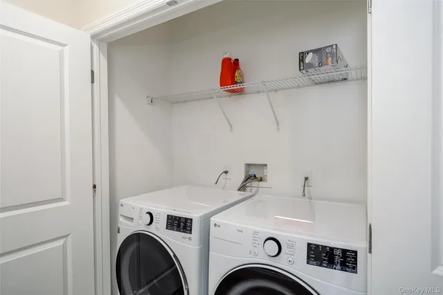 a kitchen with a refrigerator and a stove top oven