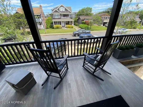 a kitchen with stainless steel appliances granite countertop a sink a stove and a wooden floors