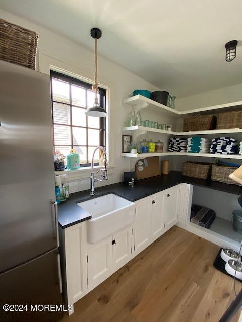 608 Lake Avenue Point Pleasant Beach, NJ 08742 - Photo 13 of 31 a kitchen with stainless steel appliances granite countertop a sink and white cabinets