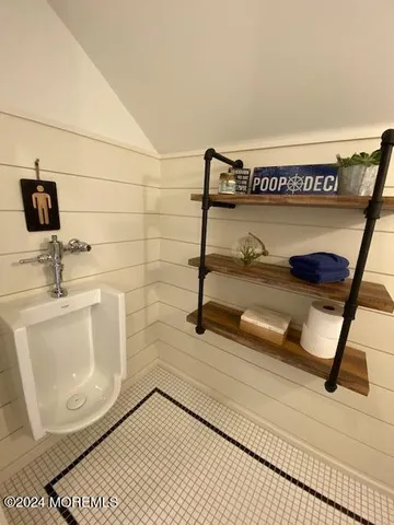 a bathroom with a sink mirror and vanity
