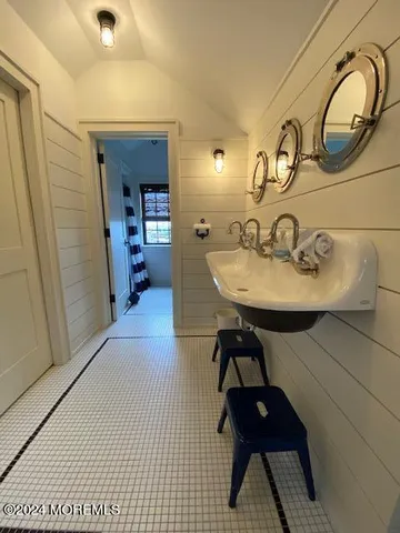 a bedroom with bed and window