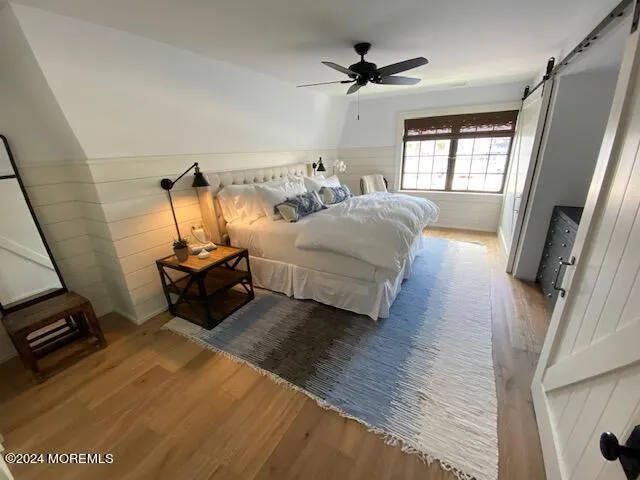 a bedroom with bed and window