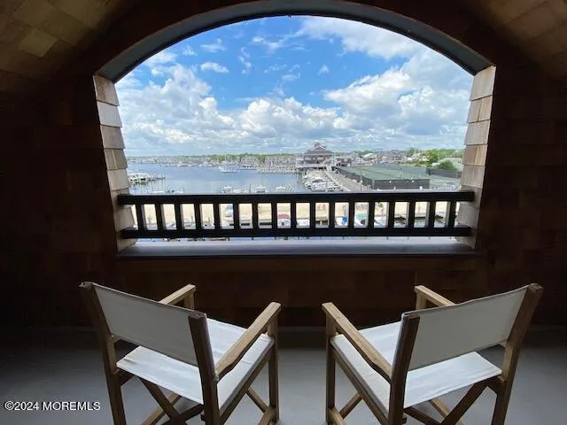 a kitchen with stainless steel appliances granite countertop a sink a stove and a wooden floors