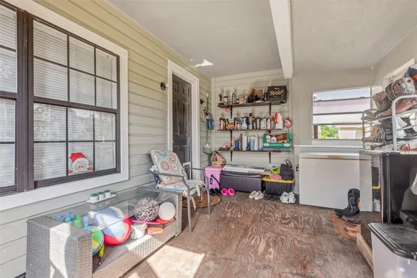 a living room filled with furniture and a window