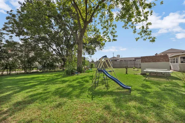 a view of a garden with a slide