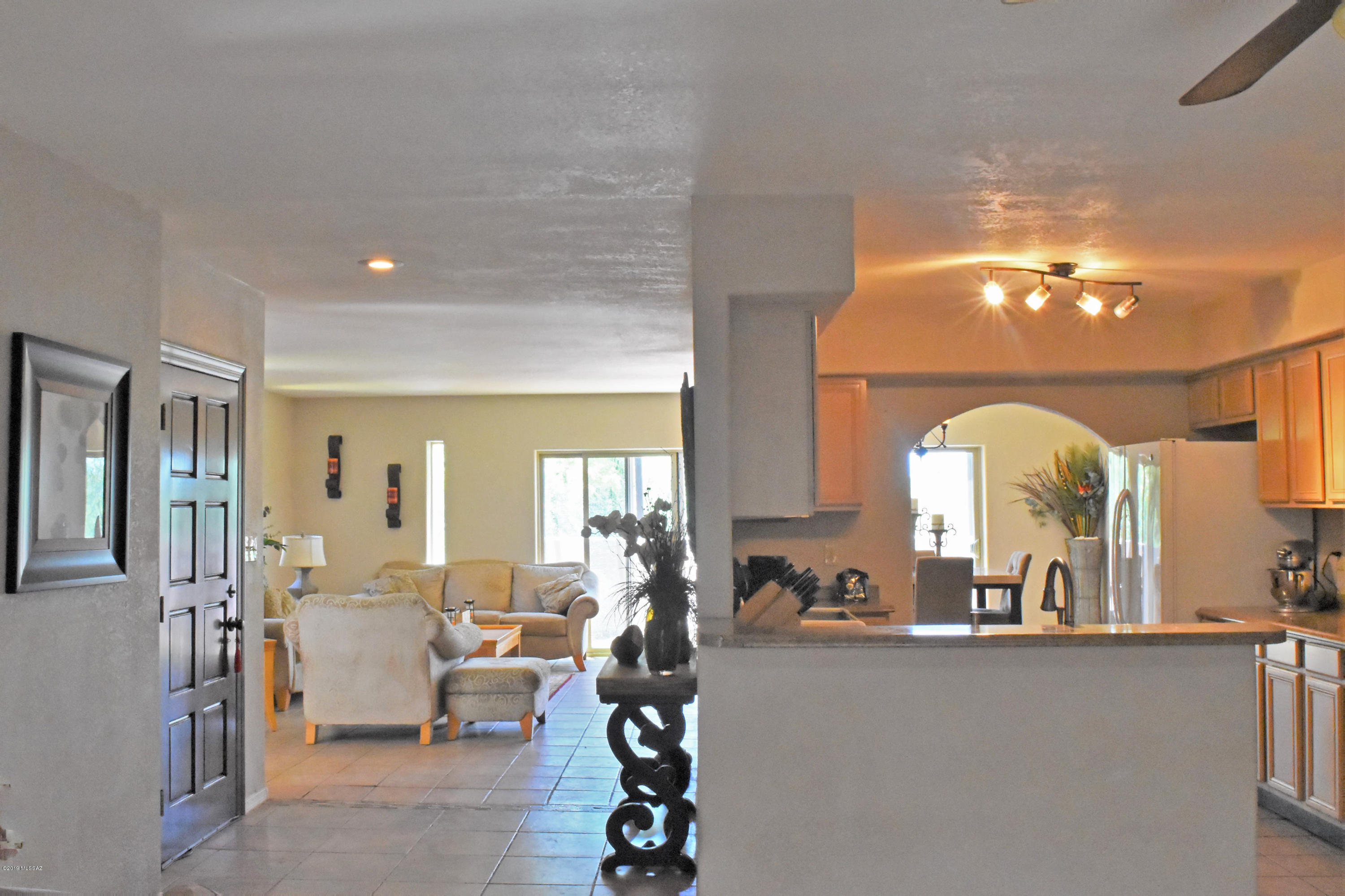 392 Willow Drive Rio Rico, AZ 85648 - Photo 9 of 25 a living room with furniture and a large mirror