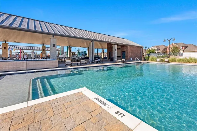 a view of a house with a backyard porch and sitting area