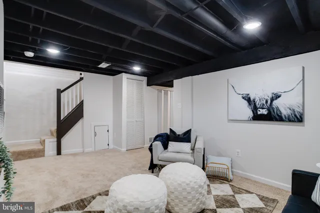 a bedroom with a bed window and lamp
