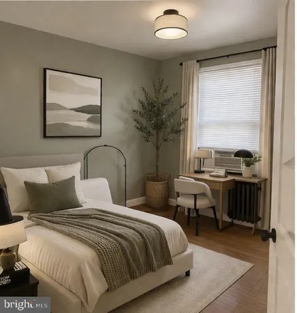 a bedroom with a large bed and a window