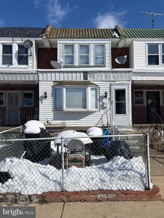 a front view of a house with parking space