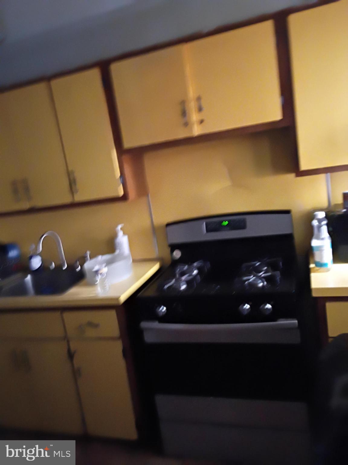 7555 Sherwood Road Philadelphia, PA 19151 - Photo 4 of 10 a bathroom with a sink and a mirror