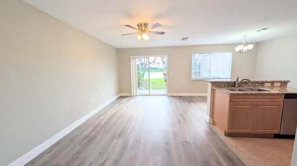 a view of a kitchen with a sink dishwasher and microwave