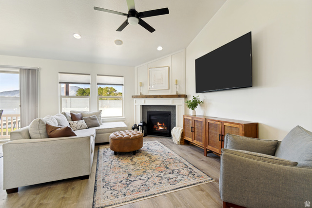 983 West 1550th Street South Springville, UT 84663 - Photo 12 of 43 Living area featuring wood-finish flooring and a contemporary ceiling fan.
