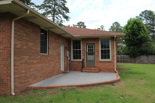 1148 Whiskey Road Aiken, SC 29801 - Photo 14 of 20 a front view of a house with a yard