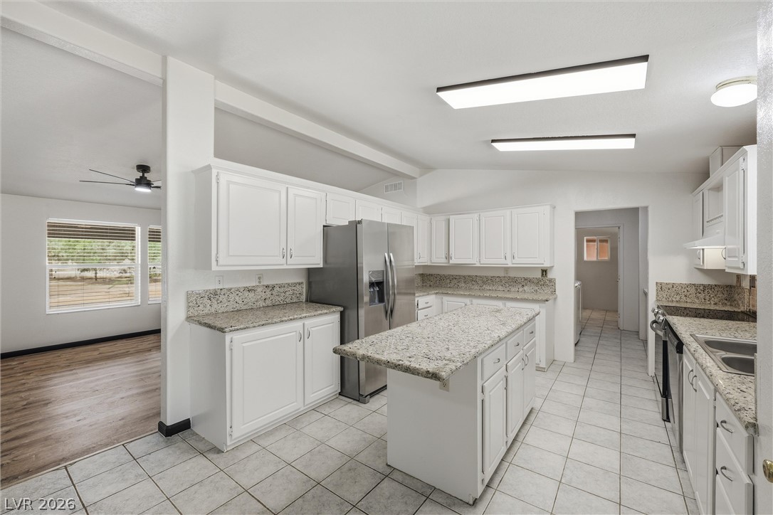1531 West Harris Farm Road Pahrump, NV 89060 - Photo 21 of 37 Culinary creations come to life in this kitchen with granite counters and stainless steel appliances.