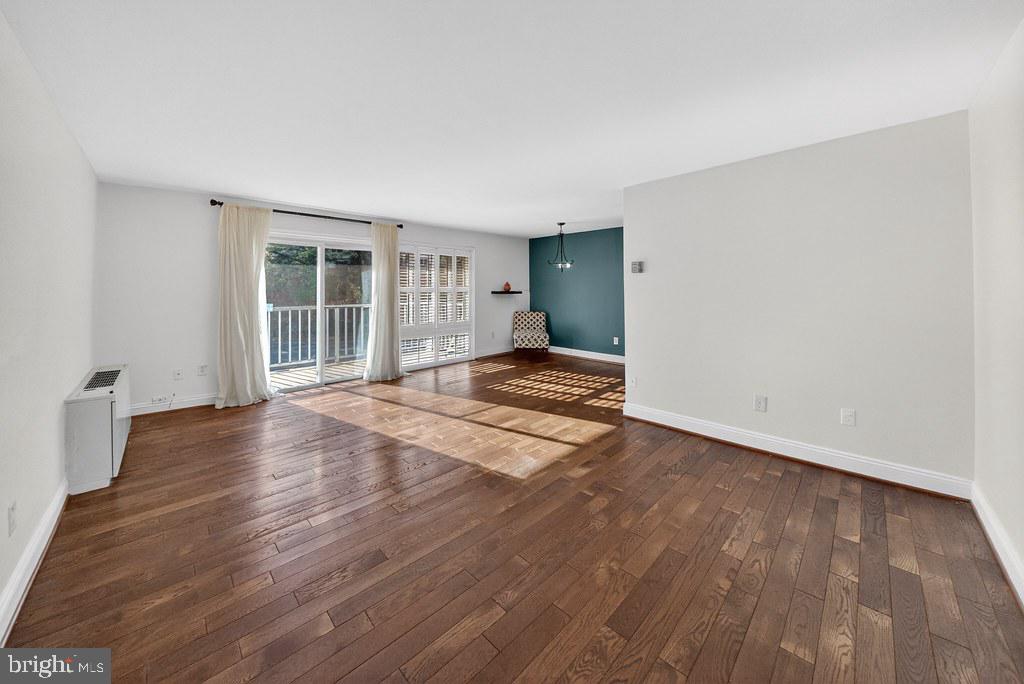 1005 Chillum Road, Unit 207 Hyattsville, MD 20782 - Photo 2 of 21 wooden floor in an empty room with a window