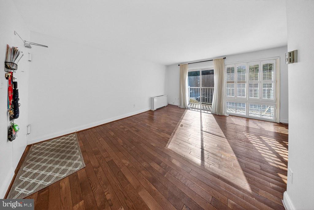 1005 Chillum Road, Unit 207 Hyattsville, MD 20782 - Photo 5 of 21 a view of a room with wooden floor and windows