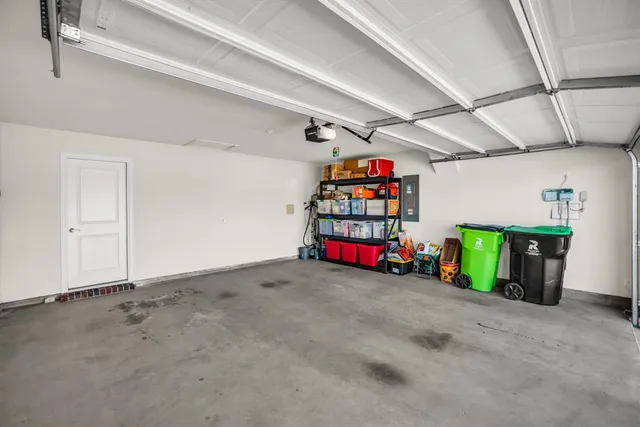 a view of a garage with storage and utility