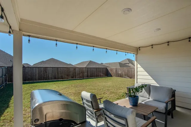 a view of a table and chairs in patio