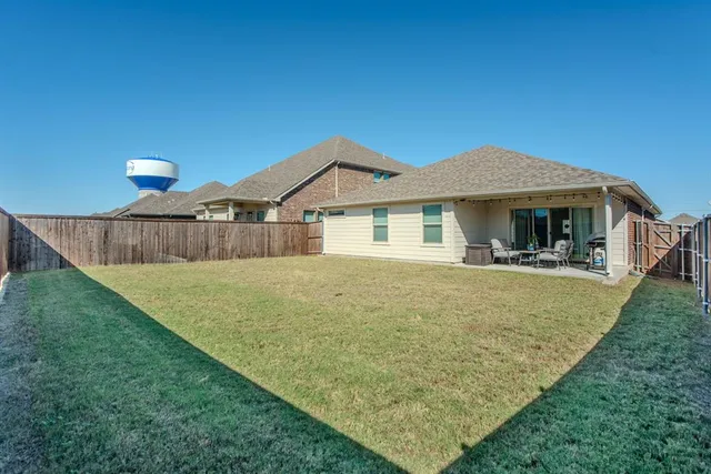 a front view of a house with yard