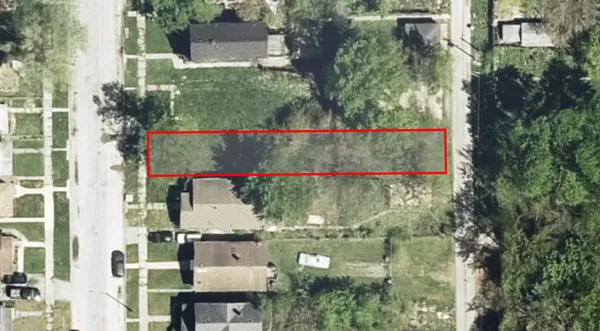 an aerial view of residential houses with outdoor space and swimming pool