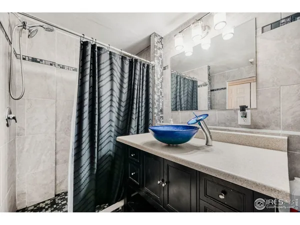 a kitchen with a sink and a refrigerator