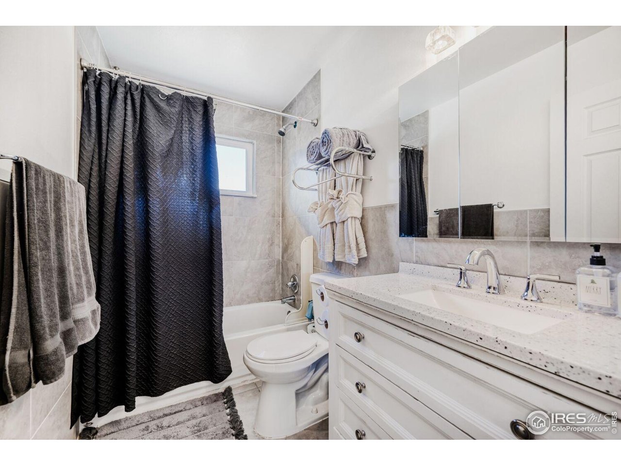 223 Fifth Street Firestone, CO 80520 - Photo 23 of 27 a bathroom with a granite countertop sink toilet and shower