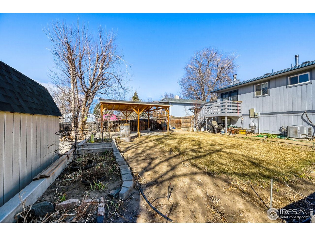 223 Fifth Street Firestone, CO 80520 - Photo 27 of 27 a swimming pool with outdoor seating and yard