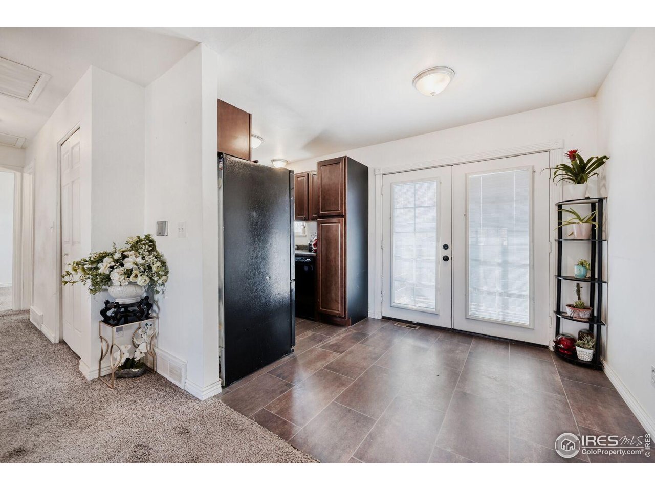 223 Fifth Street Firestone, CO 80520 - Photo 5 of 27 a view interior of a kitchen with refrigerator and wooden floor