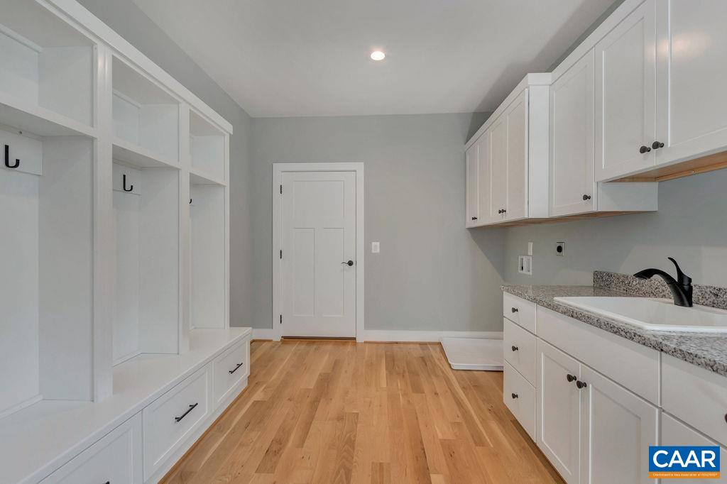 3 B Rothwell Lane, Unit LOT 3B Crozet, VA 22932 - Photo 11 of 29 a spacious bathroom with a granite countertop sink a toilet and bathtub