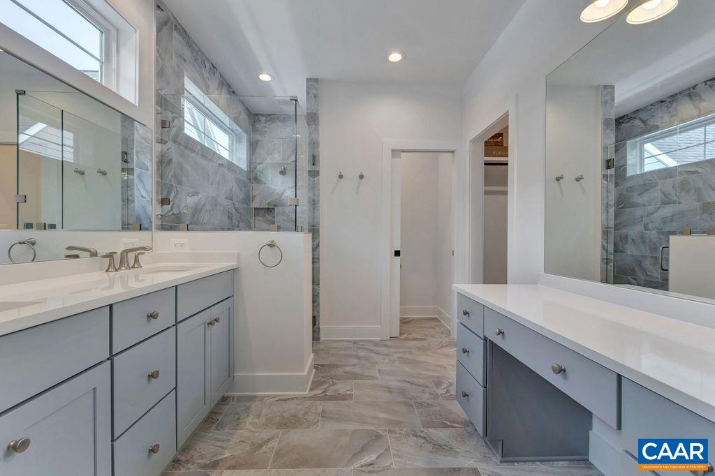 3 B Rothwell Lane, Unit LOT 3B Crozet, VA 22932 - Photo 14 of 29 a spacious bathroom with a granite countertop sink mirror and double