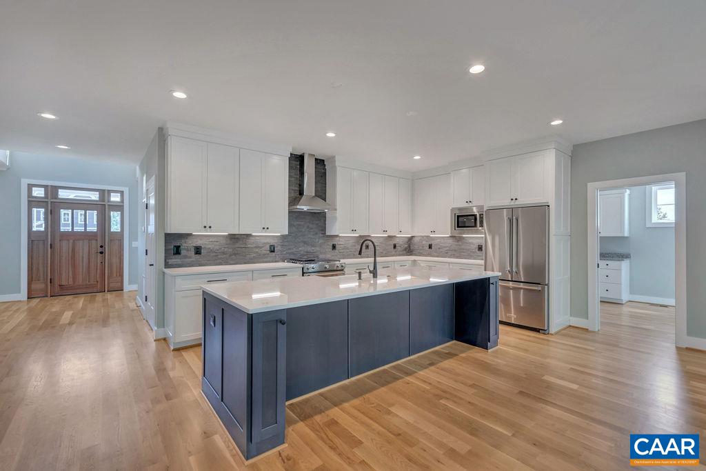 3 B Rothwell Lane, Unit LOT 3B Crozet, VA 22932 - Photo 5 of 29 a large kitchen with stainless steel appliances granite countertop a sink and cabinets