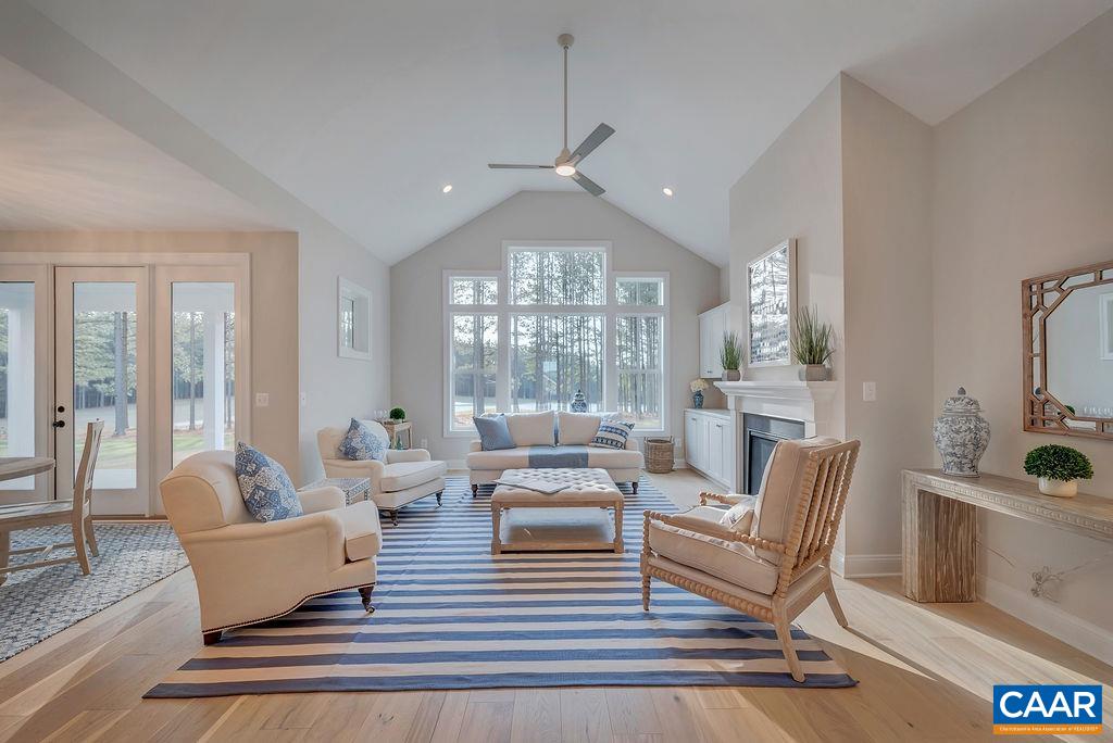 3 B Rothwell Lane, Unit LOT 3B Crozet, VA 22932 - Photo 8 of 29 a living room with furniture and a chandelier