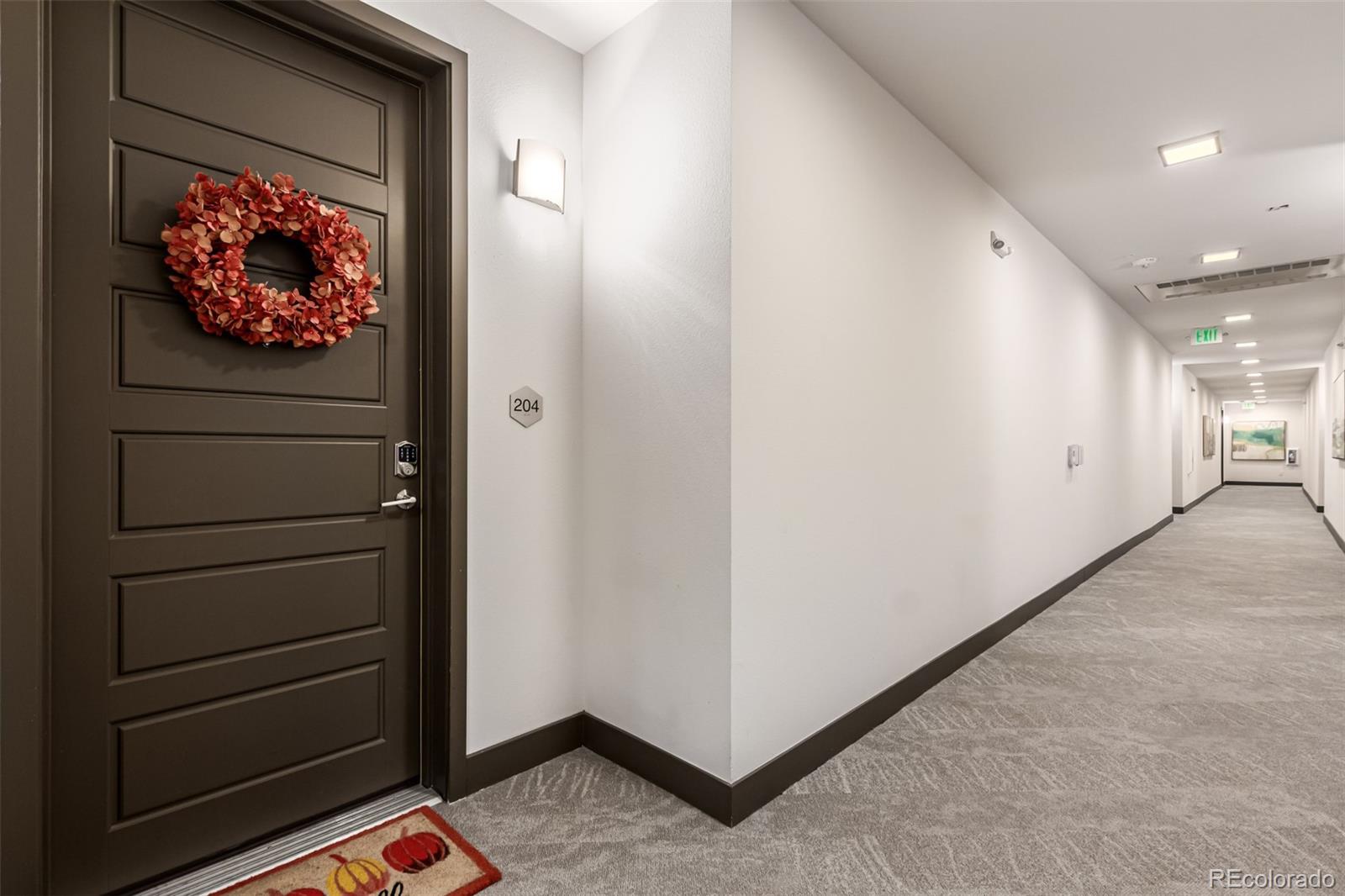 9287 Twenty Mile Road, Unit 204 Parker, CO 80134 - Photo 2 of 30 a view of a hallway with closet